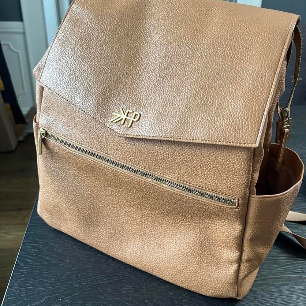 Freshly Picked Tan leather diaper bag with gold hardware. Used for ~6 months, mi